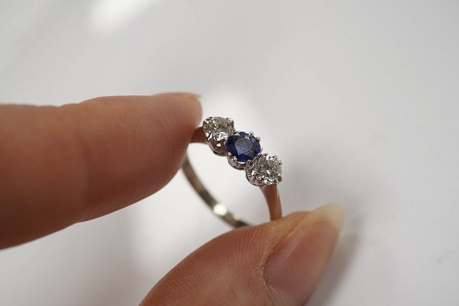 An 18ct white metal, sapphire and diamond set three stone ring, size L and two other sapphire and diamond rings, one late Victorian, gross weight 8.5 grams. Condition - fair to good